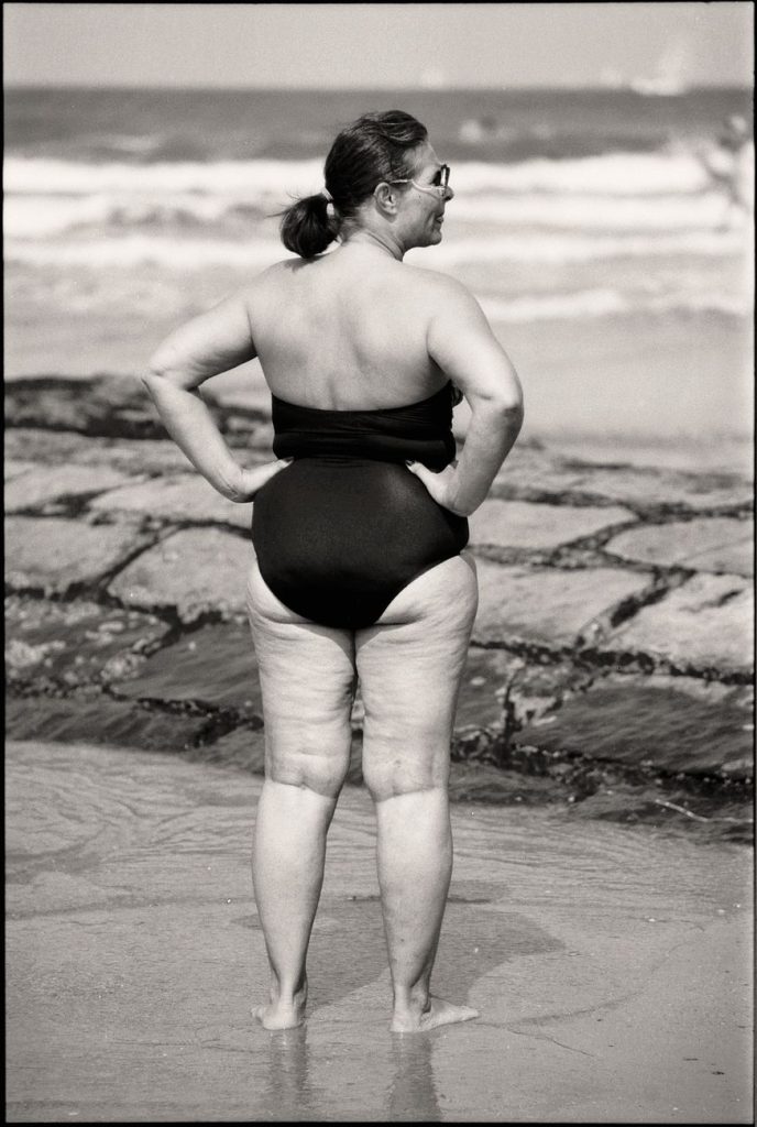 Woman in a bikini by the water