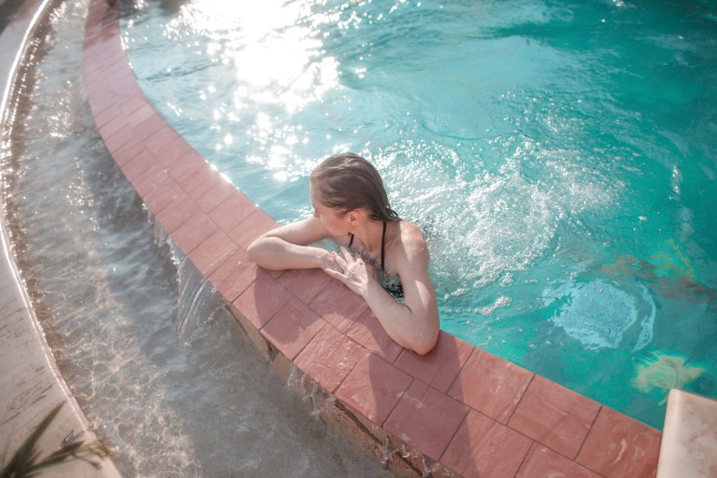 Woman in a bikini by the water