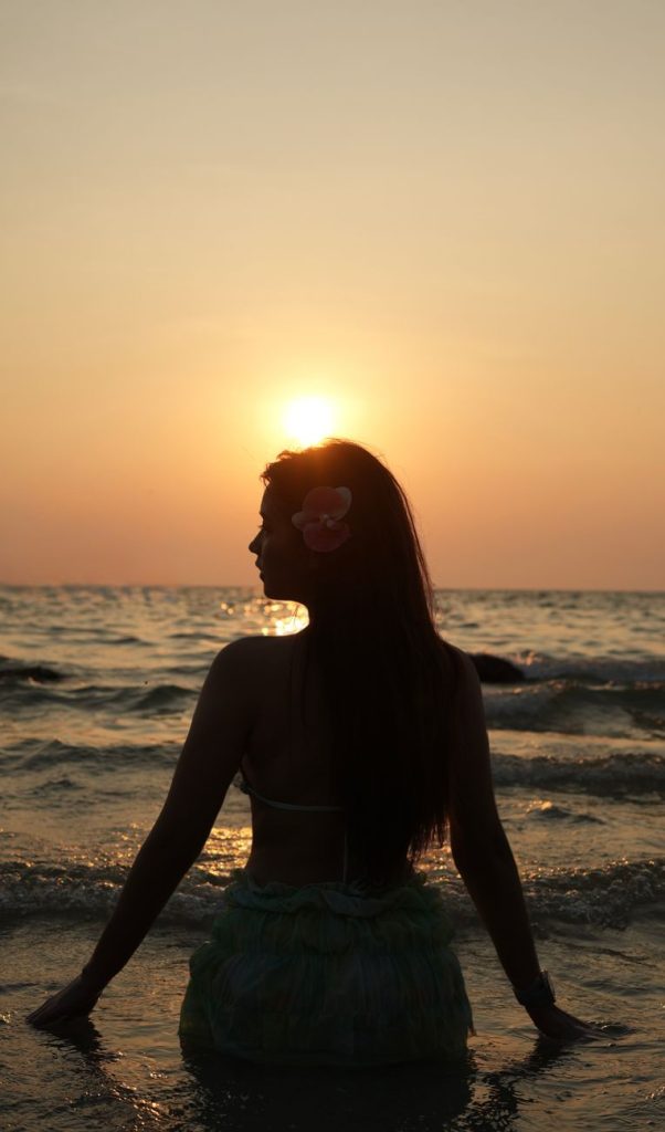Woman in a bikini by the water