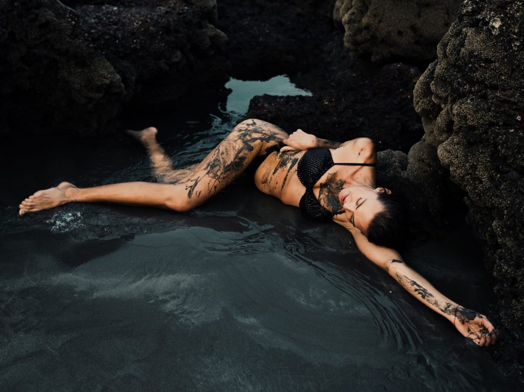 Woman in a bikini by the water
